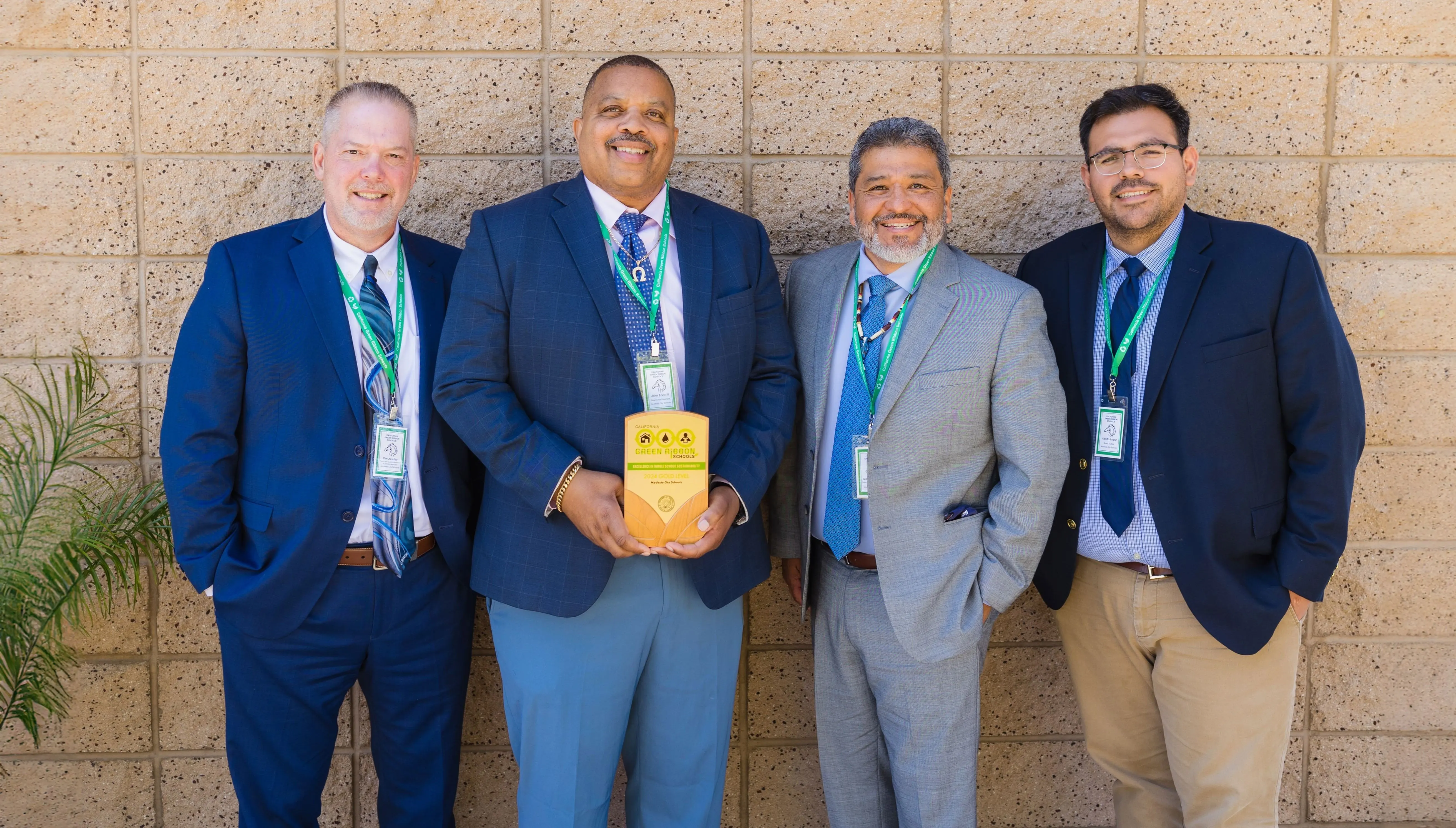 Gilbert with district partners holding a Green Ribbon award